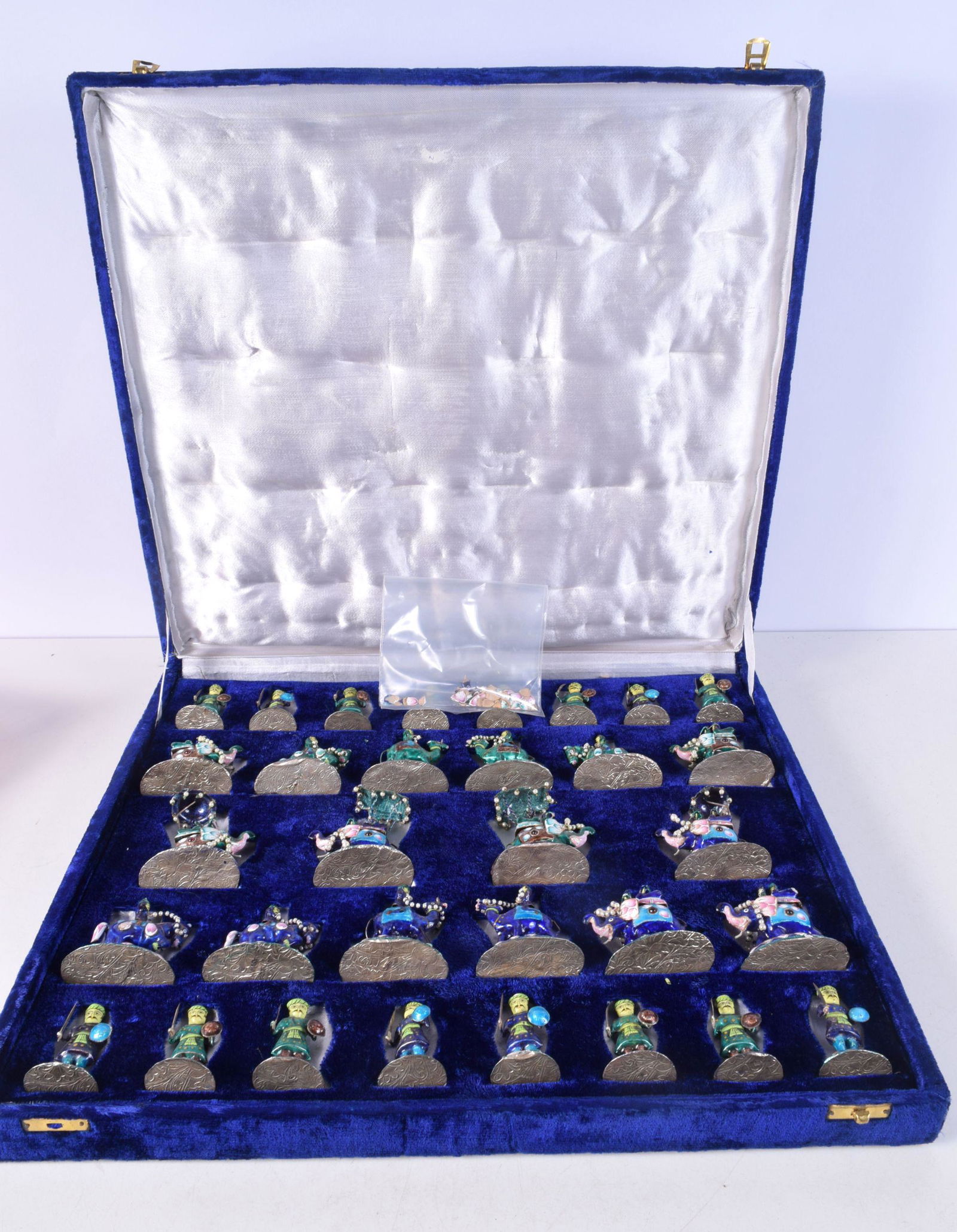 A RARE INDIAN SILVER AND ENAMEL CHESS SET modelled in various forms and sizes. 1266 grams. Largest 8 (1 of 4)