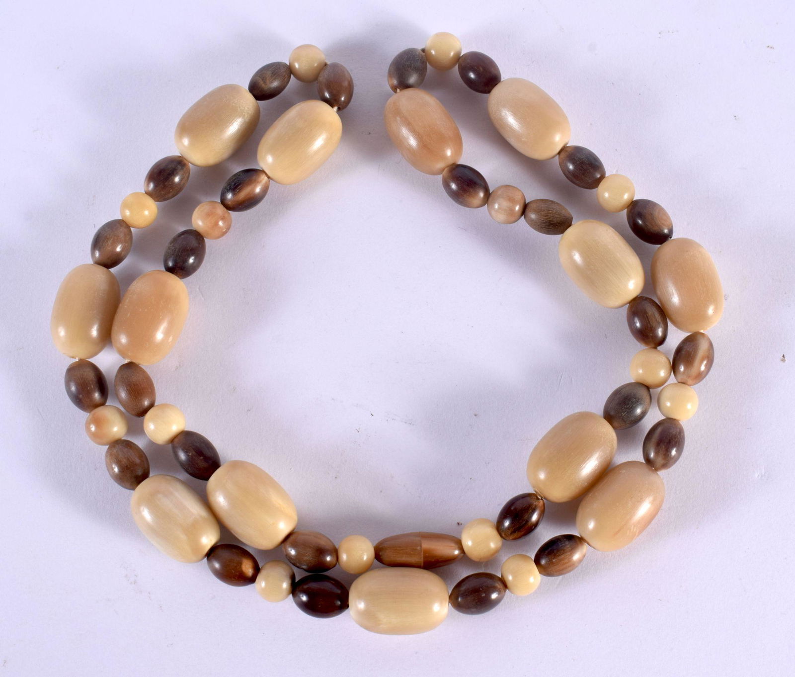 A 19TH CENTURY CHINESE CARVED BLOND RHINOCEROS HORN PRAYER BEAD NECKLACE Qing. 96 grams. 80 cm long, (1 of 3)