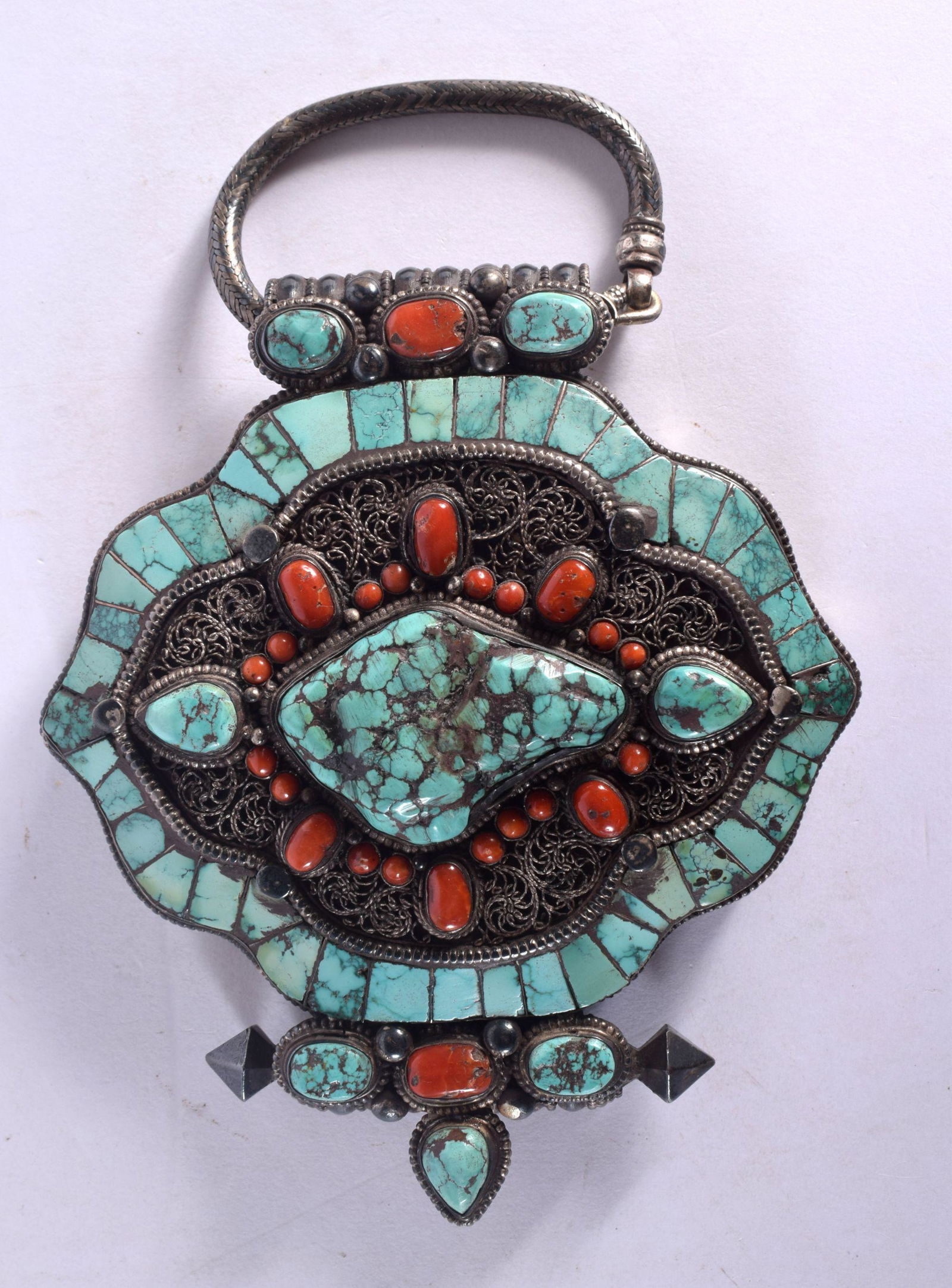 A 19TH CENTURY TIBETAN TRIBAL SILVER TURQUOISE AND CORAL HANGING PENDANT BOX with filigree decoratio (1 of 2)