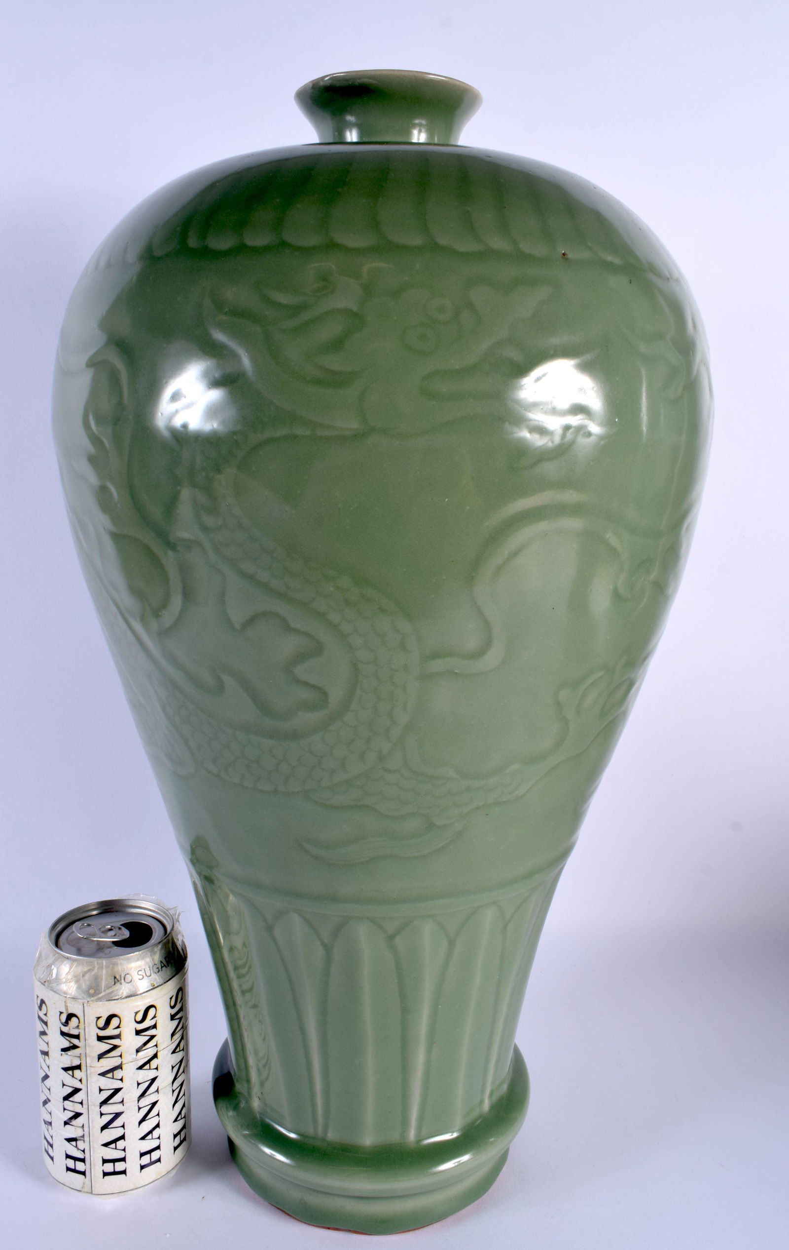 A LARGE CHINESE QING DYNASTY CELADON STONEWARE VASE decorated in relief with dragons. 45 cm x 18 cm. (1 of 5)