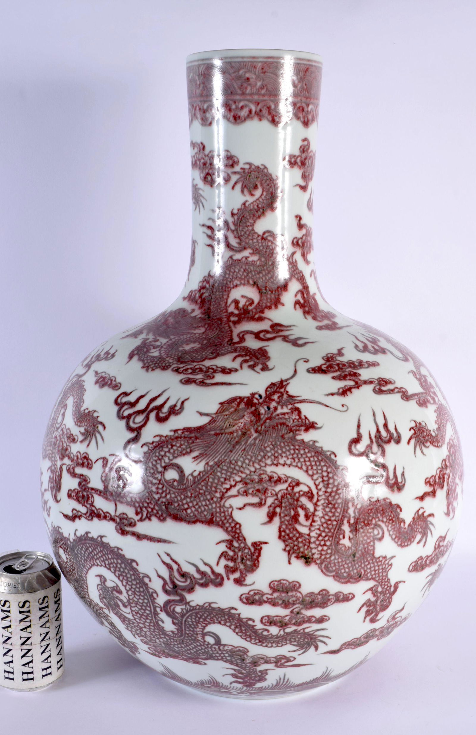 A LARGE CHINESE IRON RED GLAZED PORCELAIN BULBOUS VASE probably 19th century, bearing Qianlong marks (1 of 5)