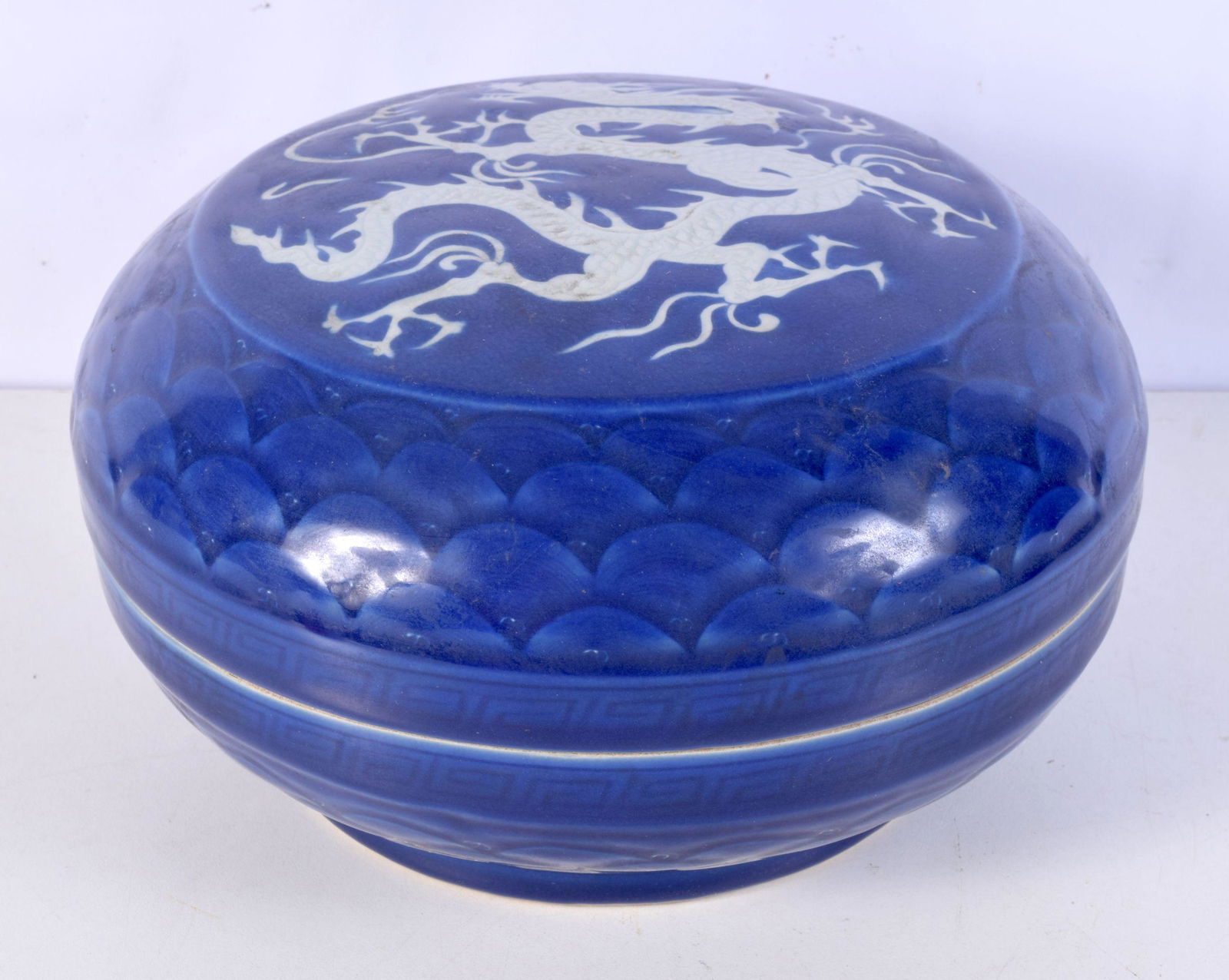 A large Chinese porcelain sacrificial blue lidded pot decorated in relief with a dragon 14 x 25 cm. (1 of 3)