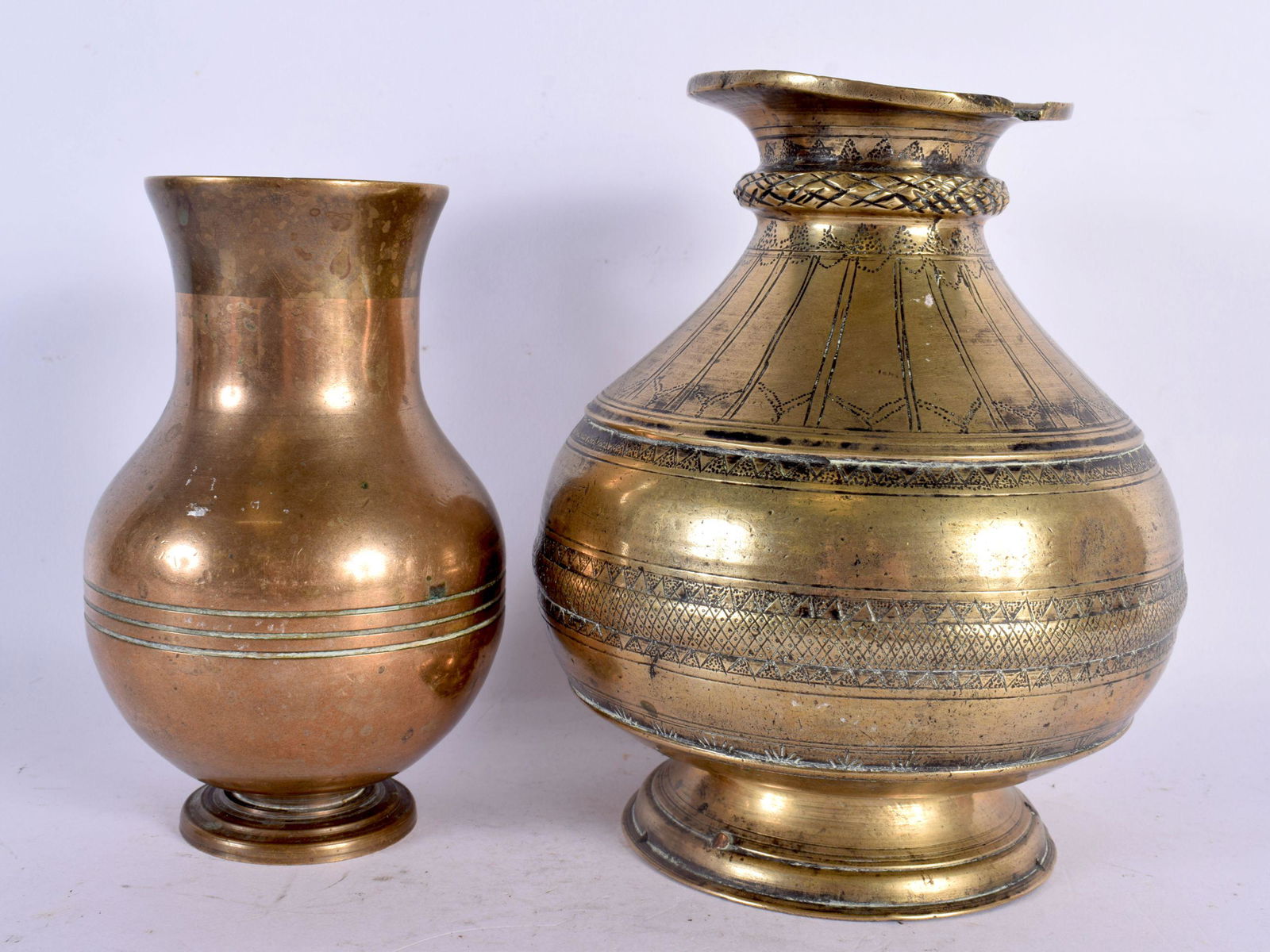 AN 18TH CENTURY MIDDLE EASTERN INDIAN BRONZE VESSEL together with a smaller similar vase. Largest 17 (1 of 4)