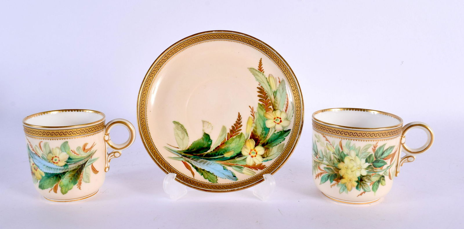 Royal Worcester coffee cup, teacup and saucer painted with Primula by David Bates date mark for 1881: Royal Worcester coffee cup, teacup and saucer painted with Primula by David Bates date mark for 1881. Saucer 14cm diameter (3)
