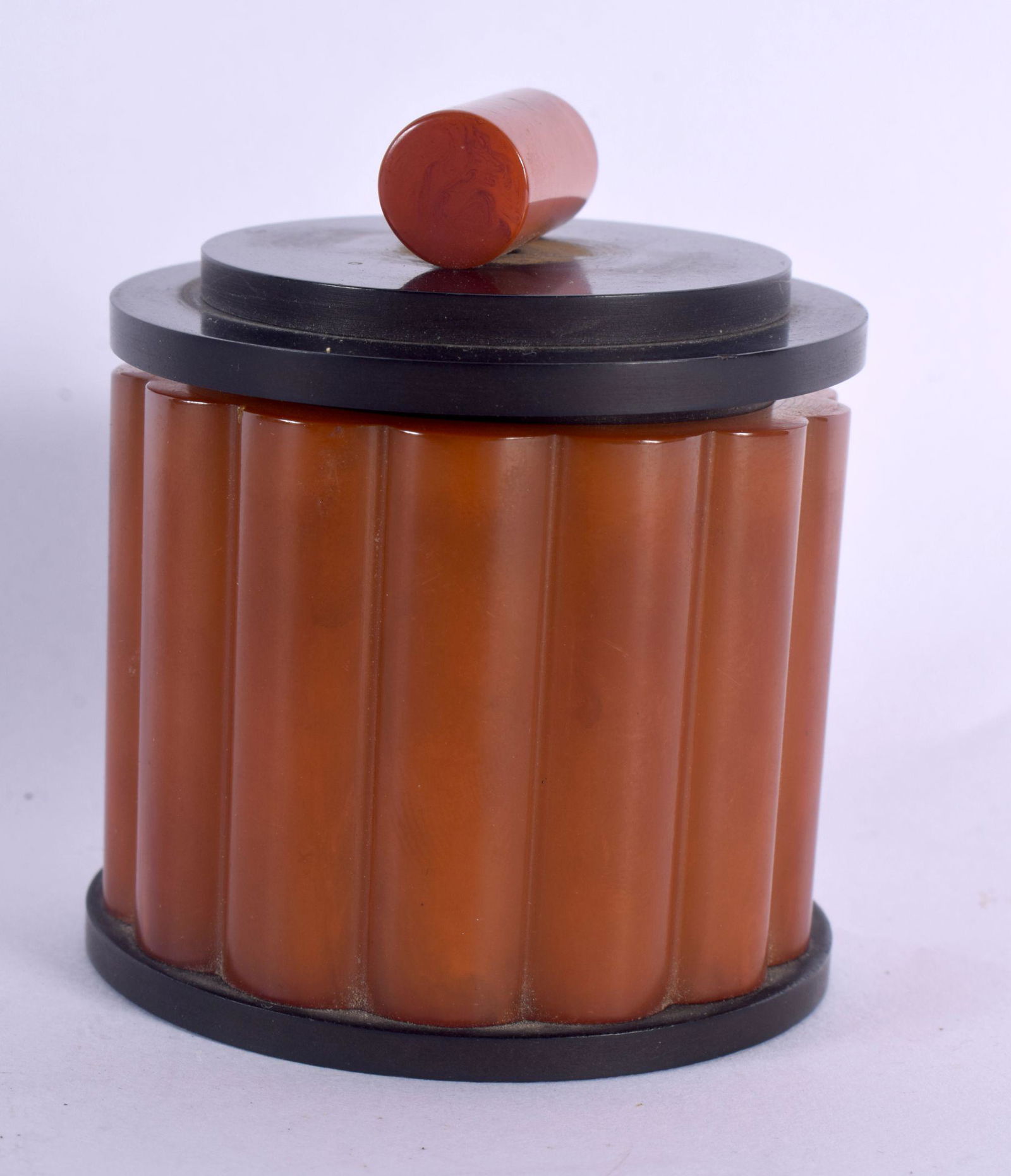 AN ART DECO ORANGE BAKELITE CATALIN JAR AND COVER. 127 grams. 8 cm x 6.5 cm. (1 of 4)