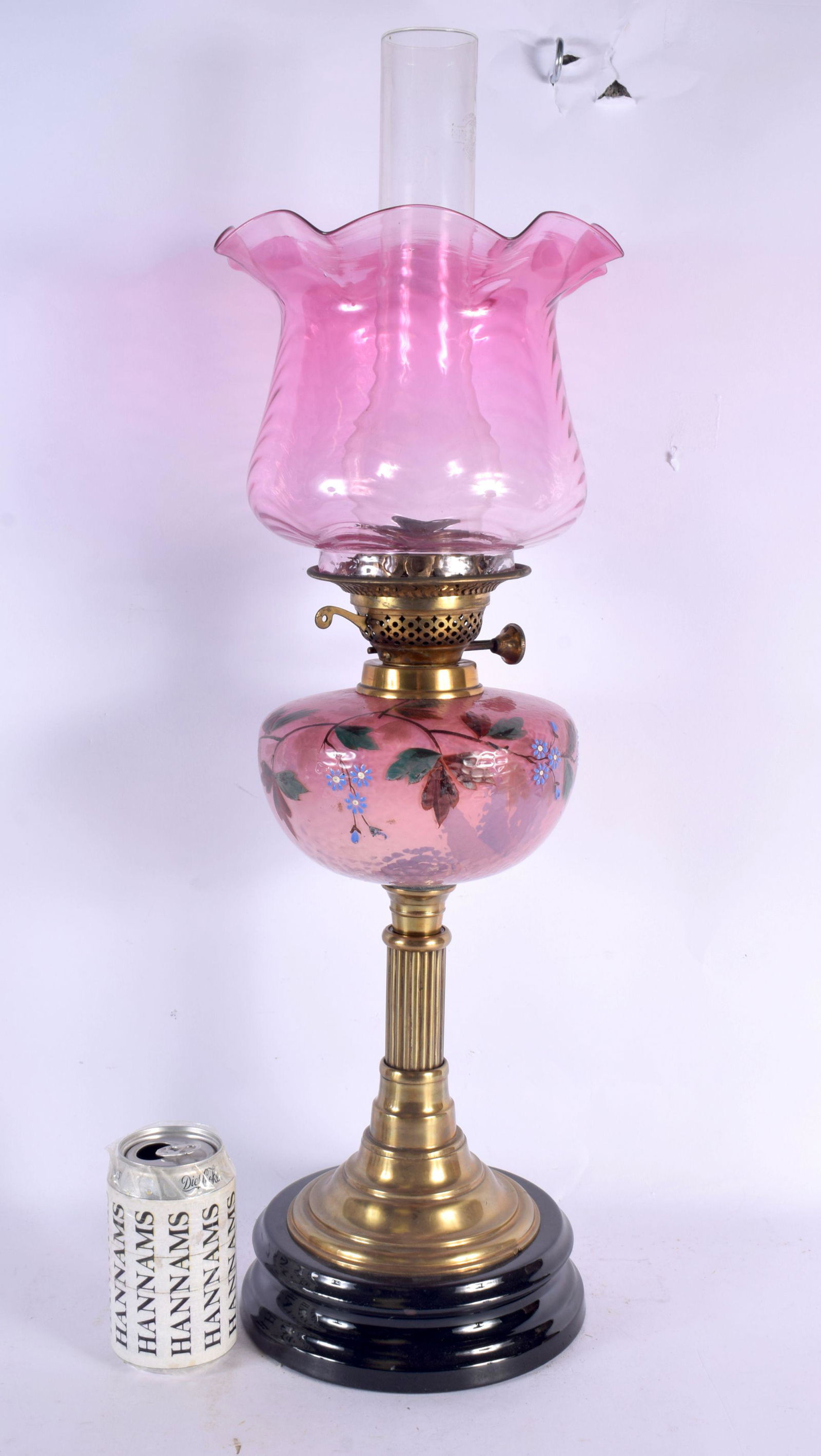 A LARGE LATE VICTORIAN PINK GLASS OIL LAMP painted with foliage and vines. 62 cm high overall. (1 of 5)