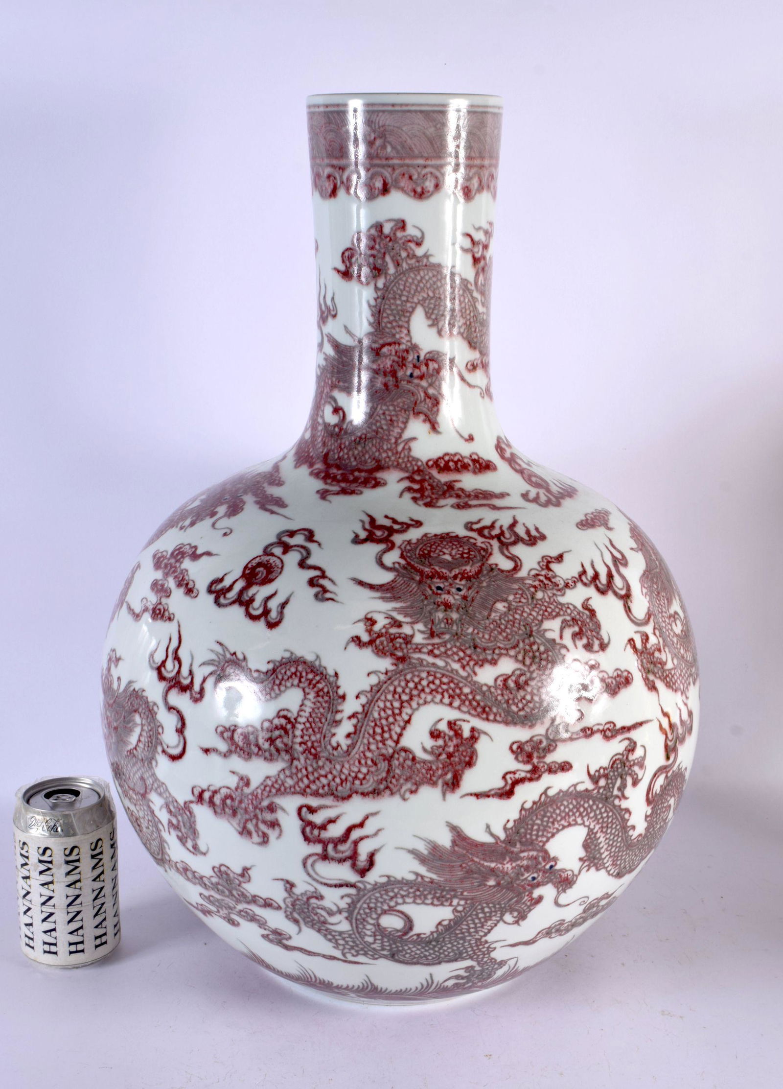 A LARGE CHINESE IRON RED GLAZED PORCELAIN BULBOUS VASE probably 19th century, bearing Qianlong marks (1 of 5)