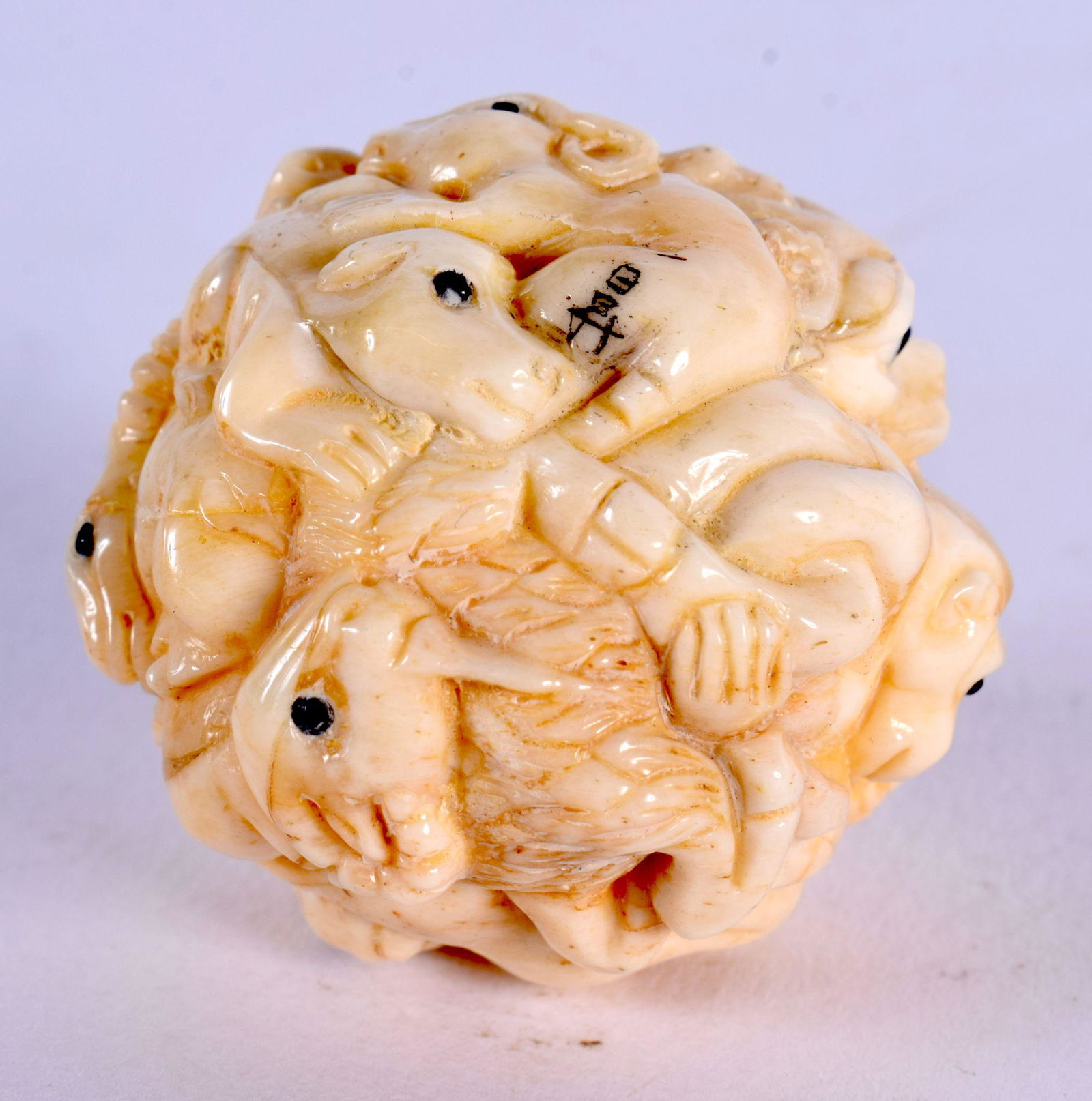 A JAPANESE CARVED BONE ZODIAC BALL. 3.25 cm wide.: A JAPANESE CARVED BONE ZODIAC BALL. 3.25 cm wide.