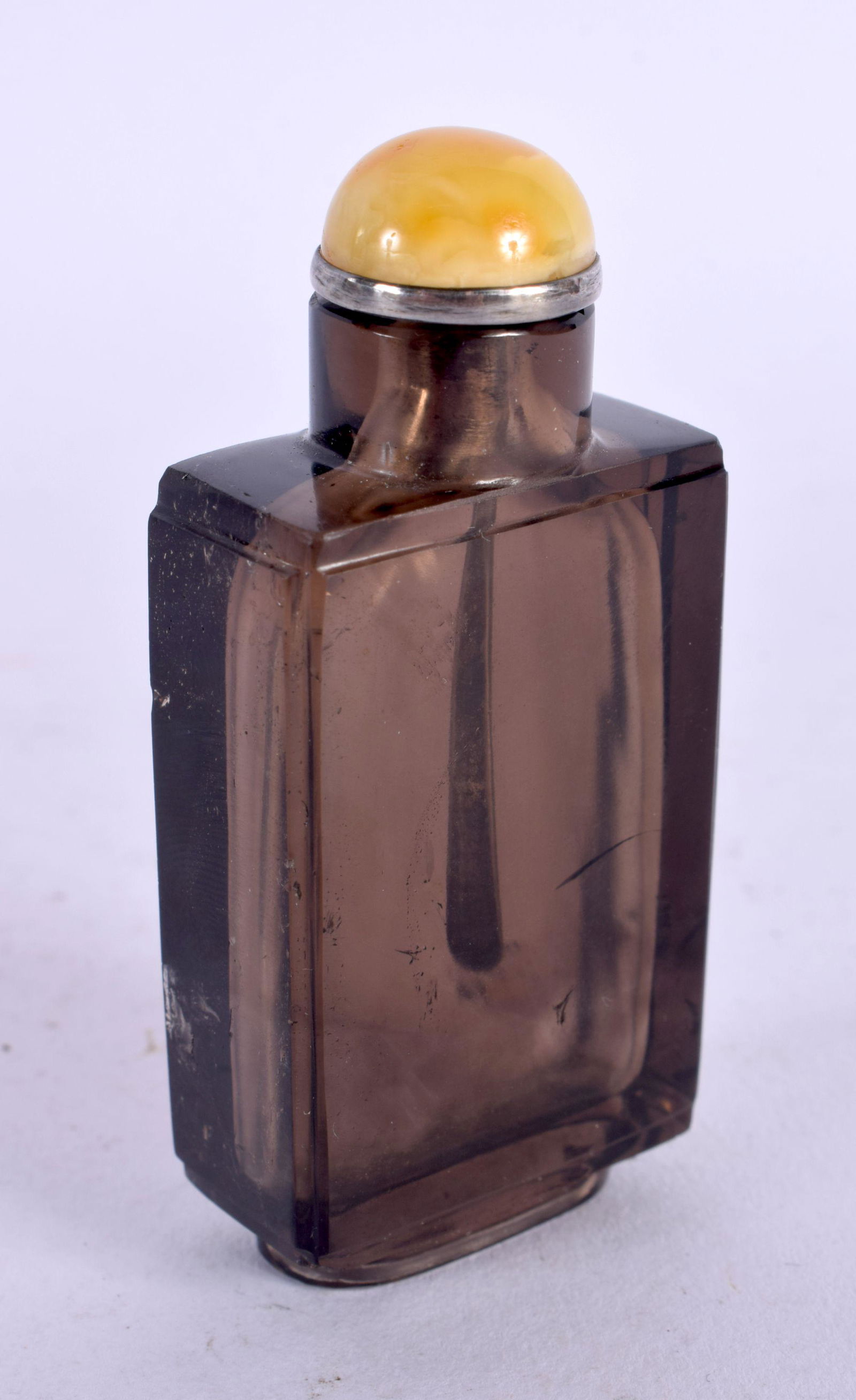 A FINE CHINESE QING DYNASTY CARVED SMOKEY QUARTZ CRYSTAL SNUFF BOTTLE with silver and amber stopper. (1 of 4)