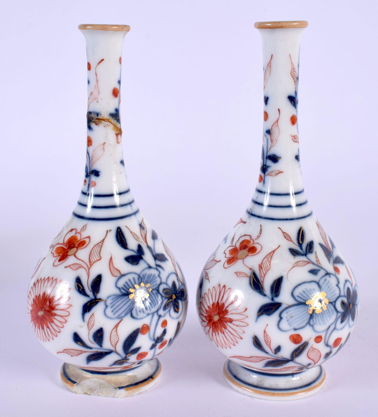 A SMALL PAIR OF CHINESE QING DYNASTY BLUE AND WHITE VASES painted with flowers. 13 cm high. (1 of 4)