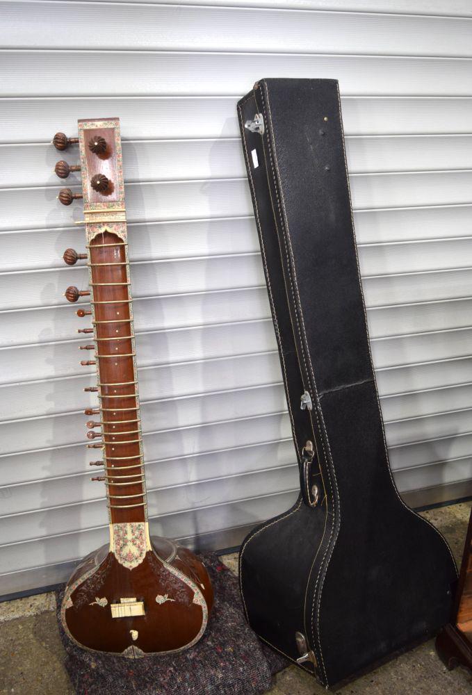 A cased Indian Kartarchand New Delhi Sitar 133 x 44cm.: A cased Indian Kartarchand New Delhi Sitar 133 x 44cm.