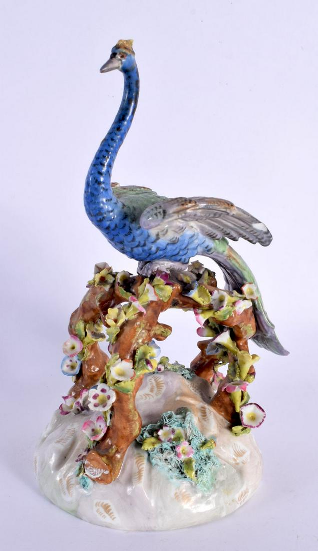 A LARGE 19TH CENTURY MEISSEN PORCELAIN FIGURE OF A BIRD modelled upon a naturalistic base. 21.5 cm h (1 of 3)