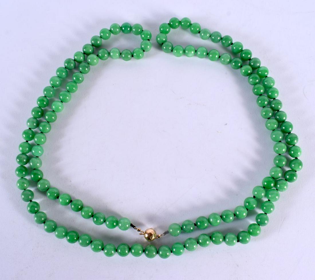 A 14CT GOLD CHINESE JADEITE NECKLACE. 307 grams. 144 cm long. (1 of 2)