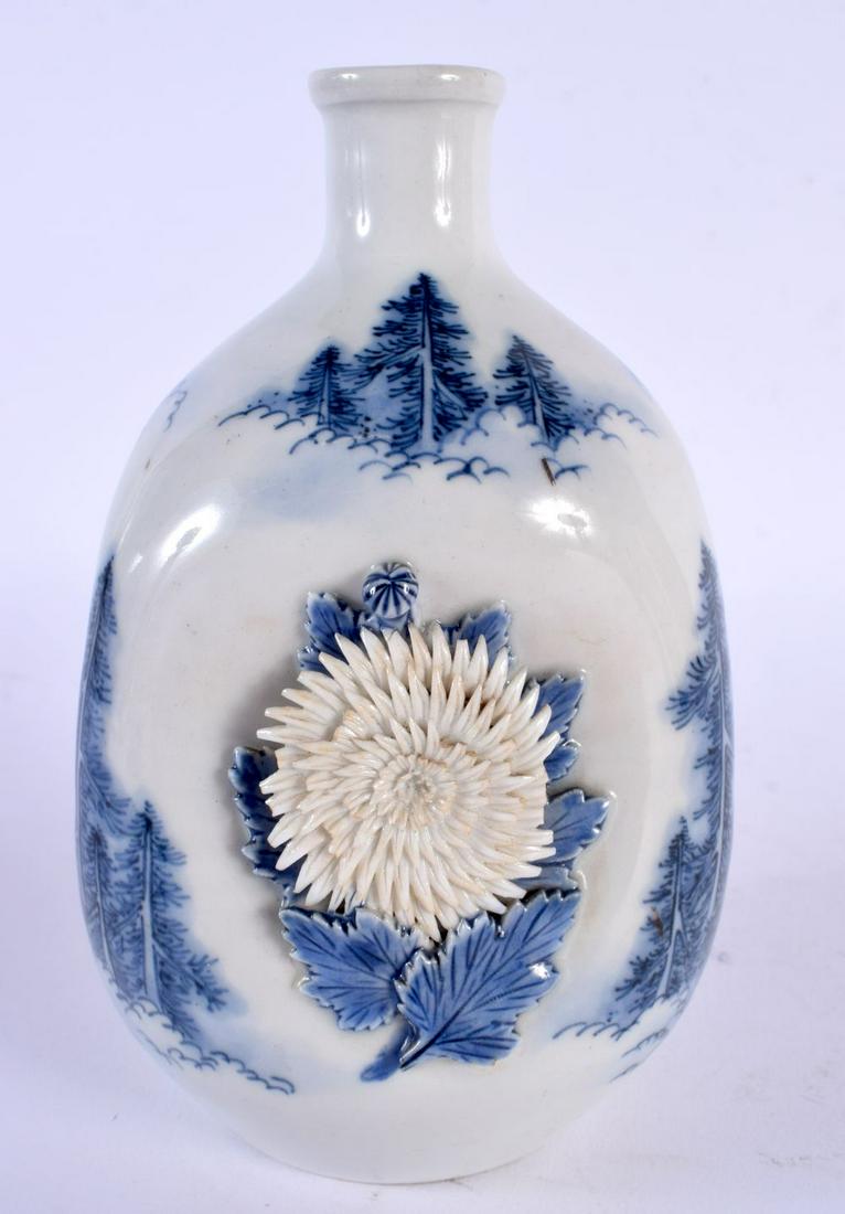 A RARE 19TH CENTURY JAPANESE MEIJI PERIOD BLUE AND WHITE HIRADO PORCELAIN VASE with unusual unglazed: A RARE 19TH CENTURY JAPANESE MEIJI PERIOD BLUE AND WHITE HIRADO PORCELAIN VASE with unusual unglazed raised bisque flowers. 15 cm high.