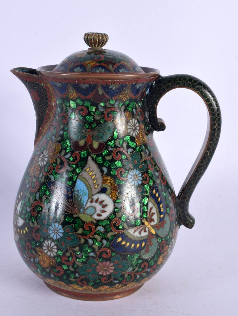 A 19TH CENTURY JAPANESE MEIJI PERIOD CLOISONNE ENAMEL JUG AND COVER decorated with insects and folia: A 19TH CENTURY JAPANESE MEIJI PERIOD CLOISONNE ENAMEL JUG AND COVER decorated with insects and foliage. 14 cm high.