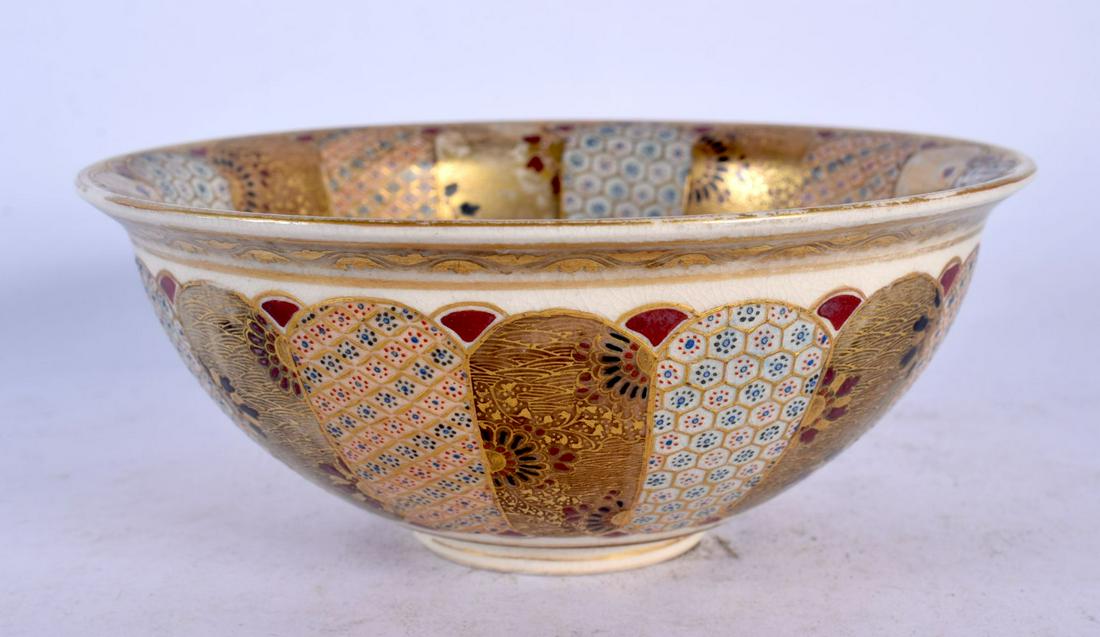 A 19TH CENTURY JAPANESE MEIJI PERIOD SATSUMA BOWL painted with motifs. 12 cm diameter.: A 19TH CENTURY JAPANESE MEIJI PERIOD SATSUMA BOWL painted with motifs. 12 cm diameter.