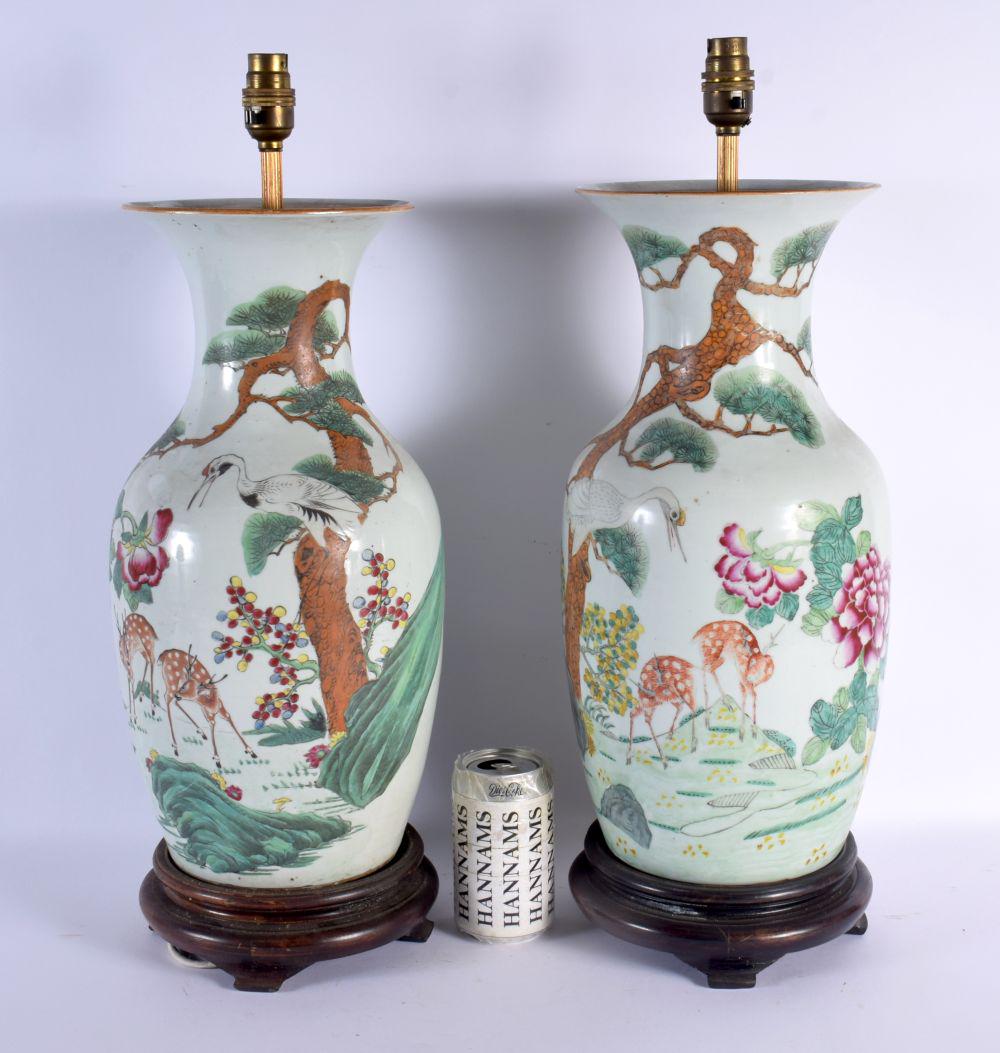A PAIR OF CHINESE REPUBLICAN PERIOD FAMILLE ROSE PORCELAIN LAMPS. 48 cm high.: A PAIR OF CHINESE REPUBLICAN PERIOD FAMILLE ROSE PORCELAIN LAMPS. 48 cm high.