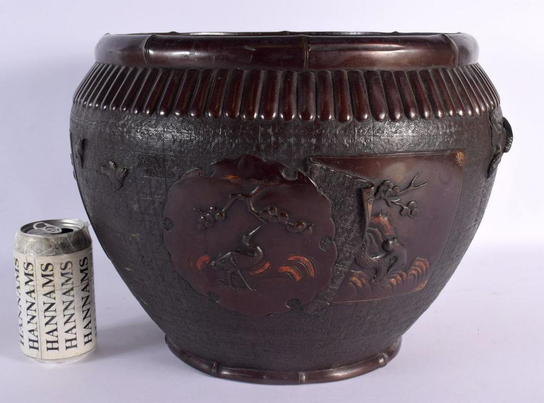 A LARGE 19TH CENTURY JAPANESE MEIJI PERIOD BRONZE JARDINIERE decorated with landscapes. 34 cm x 28 c: A LARGE 19TH CENTURY JAPANESE MEIJI PERIOD BRONZE JARDINIERE decorated with landscapes. 34 cm x 28 cm.