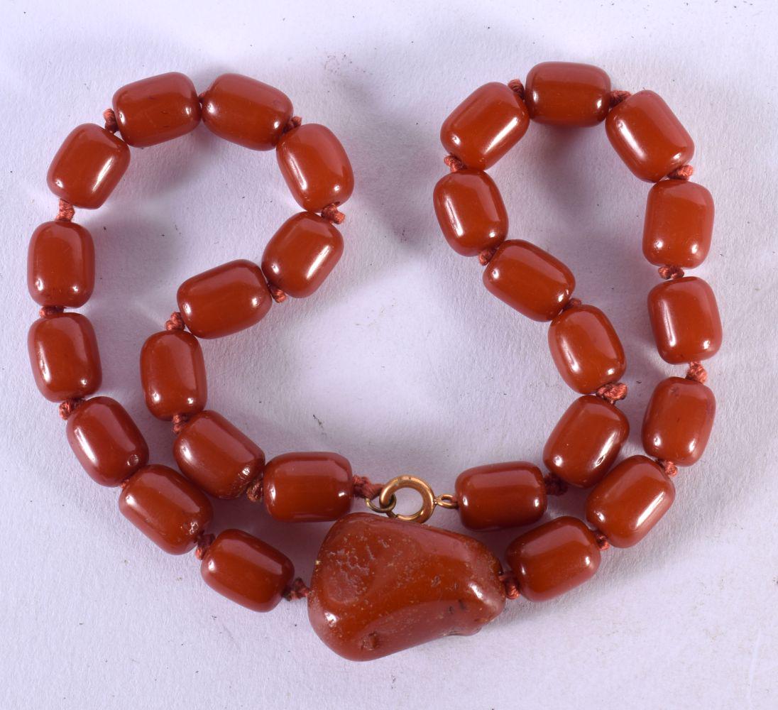 A CHERRY AMBER TYPE NECKLACE. 42 grams. 46 cm long. (1 of 3)