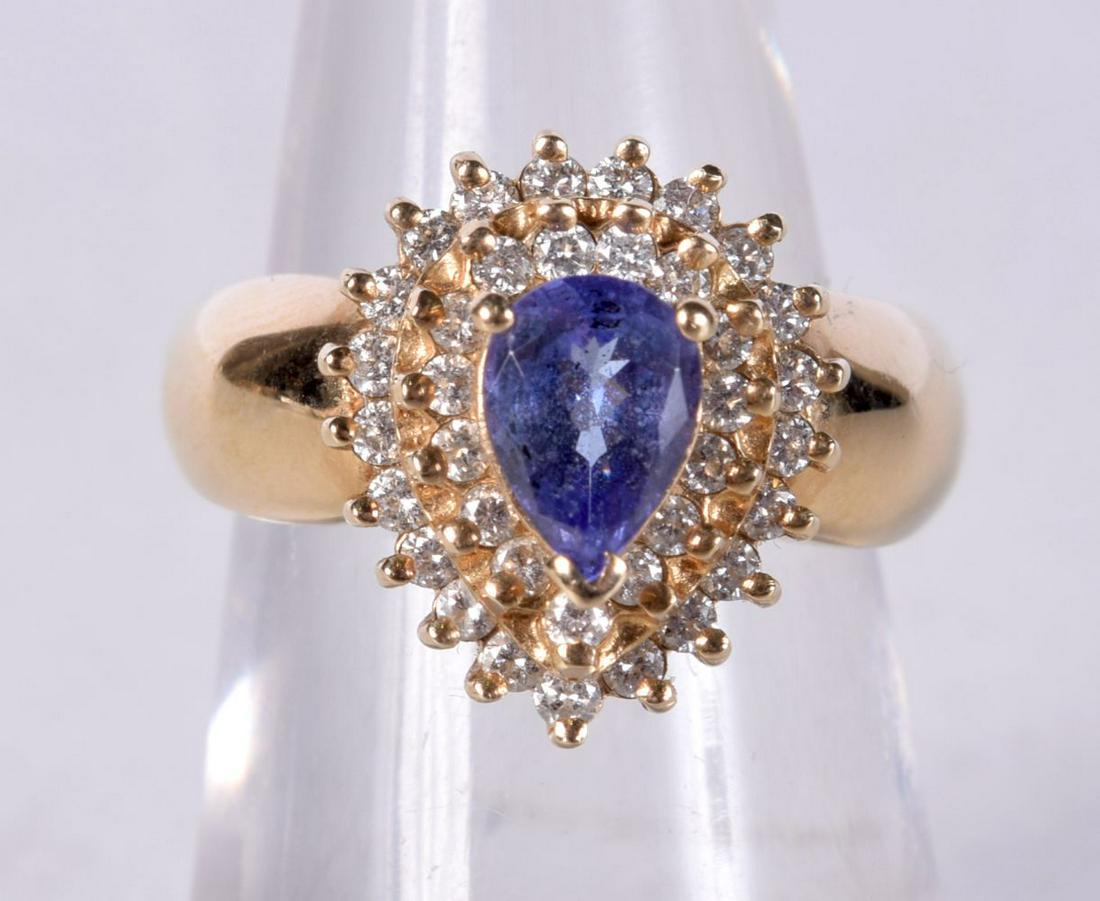 A 14CT GOLD DIAMOND AND TANZANITE RING. K. 5.8 grams. (1 of 3)