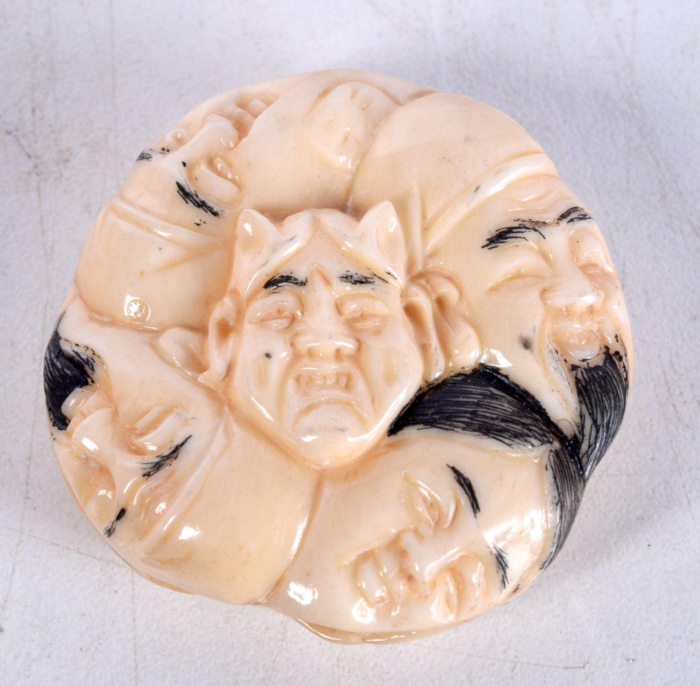 A JAPANESE BONE MASK NETSUKE. 4 cm wide.: A JAPANESE BONE MASK NETSUKE. 4 cm wide.