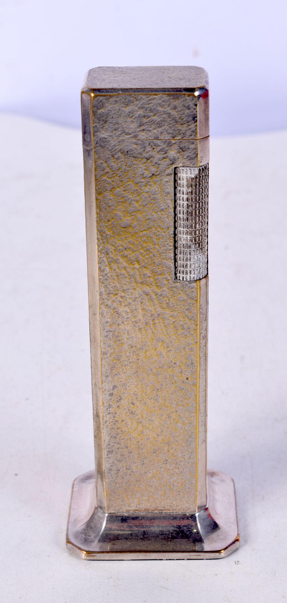 A VINTAGE DUNHILL TALLBOY LIGHTER. 11 cm high.: A VINTAGE DUNHILL TALLBOY LIGHTER. 11 cm high.