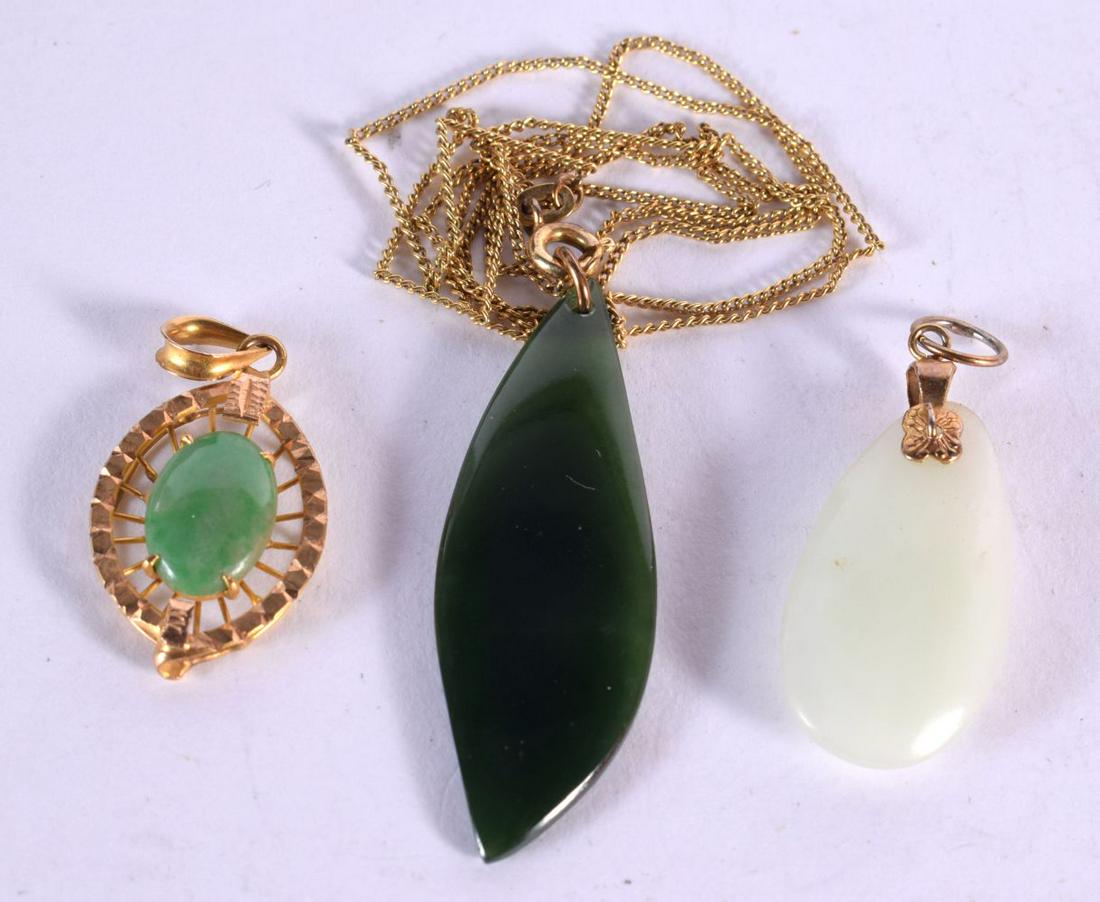 THREE YELLOW METAL JADE PENDANTS. 8.6 grams. Largest 46 cm long. (3) (1 of 2)