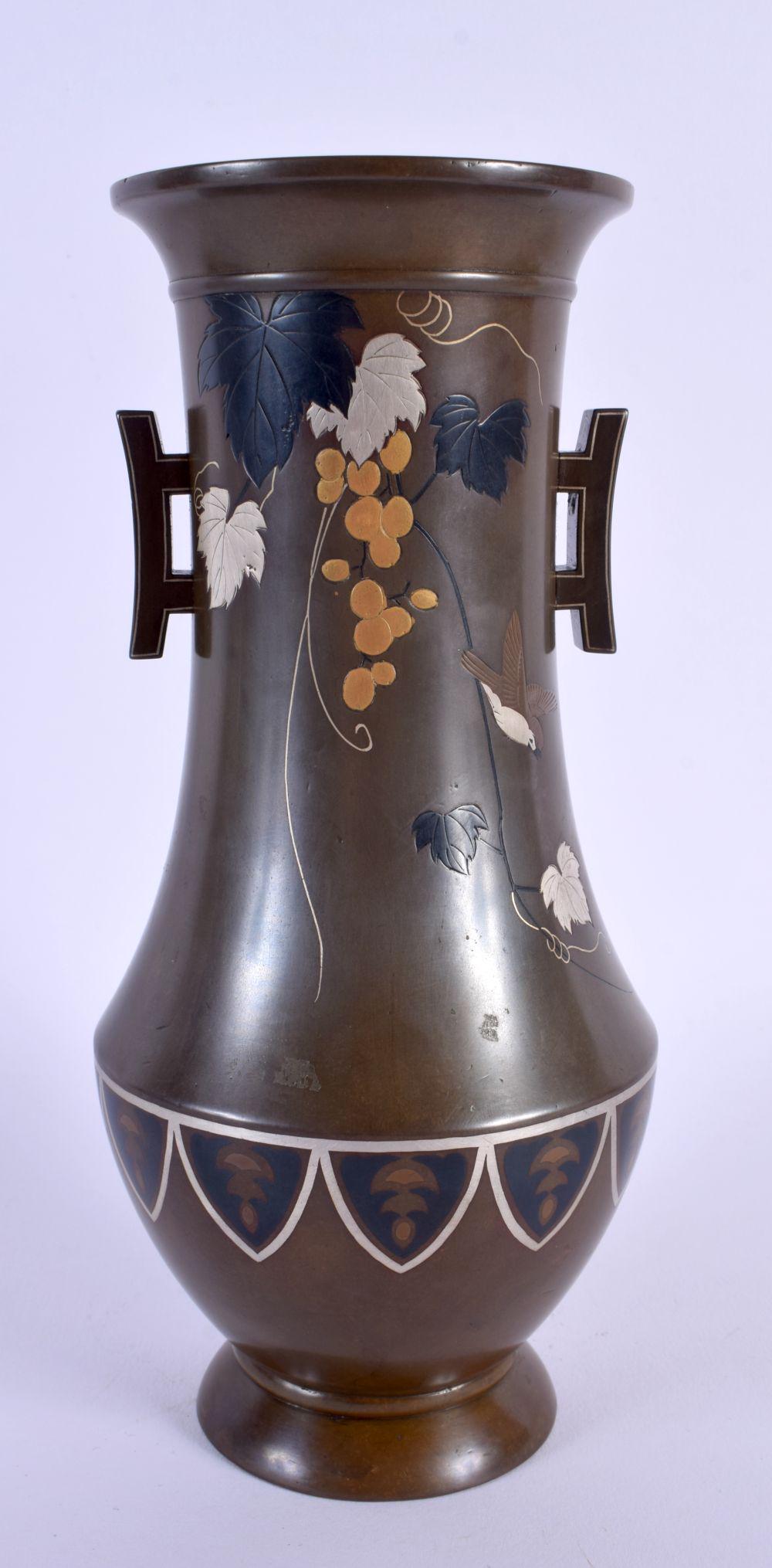 A 19TH CENTURY JAPANESE MEIJI PERIOD GOLD AND SILVER INLAID BRONZE VASE decorated with foliage. 22 c (1 of 6)