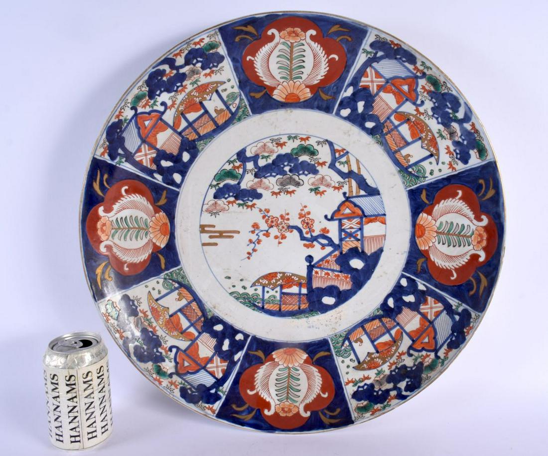 A LARGE 19TH CENTURY JAPANESE MEIJI PERIOD IMARI CHARGER painted with landscapes. 45 cm diameter. (1 of 6)