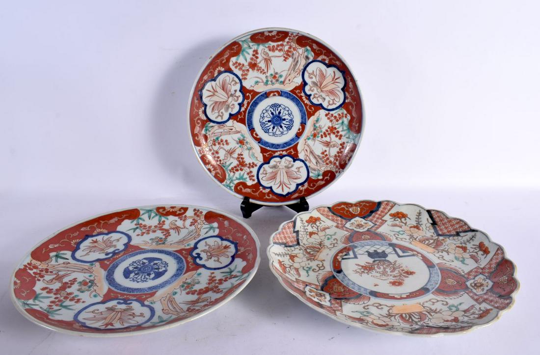 THREE 19TH CENTURY JAPANESE MEIJI PERIOD IMARI PLATES painted with landscapes. 30 cm wide. (3) (1 of 7)