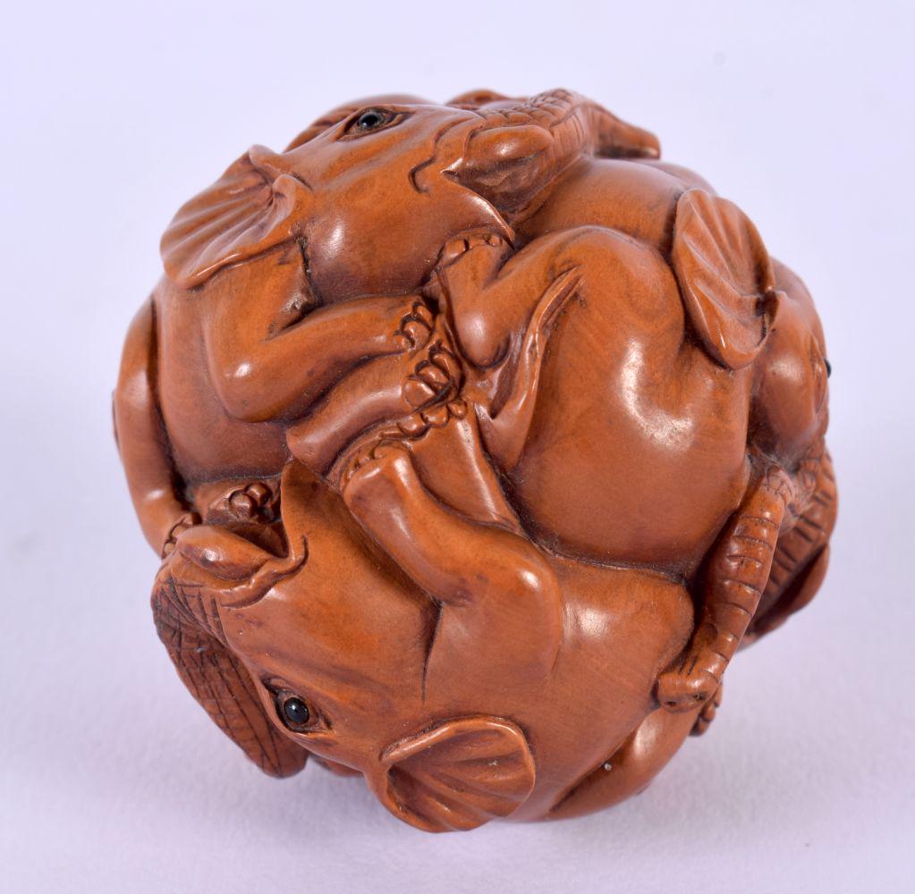 A JAPANESE CARVED WOOD ELEPHANT BALL. 5.25 cm wide. (1 of 5)