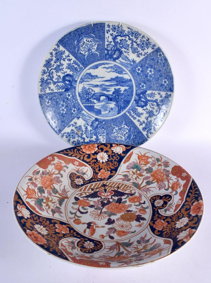AN EARLY 20TH CENTURY JAPANESE MEIJI PERIOD BLUE AND WHITE CHARGER together with a large imari bowl. (1 of 5)