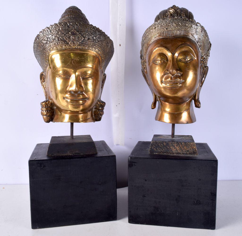 Two bronzed South Eastern Asian Buddha heads on wooden plinth 26 cm (2) (1 of 9)