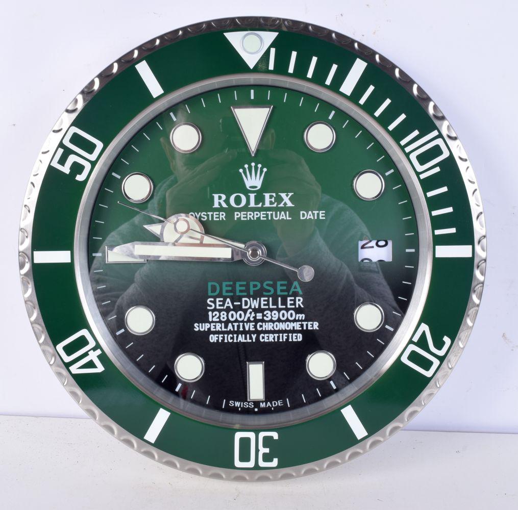 A Contemporary Rolex dealership style wall clock 34 cm.: A Contemporary Rolex dealership style wall clock 34 cm.