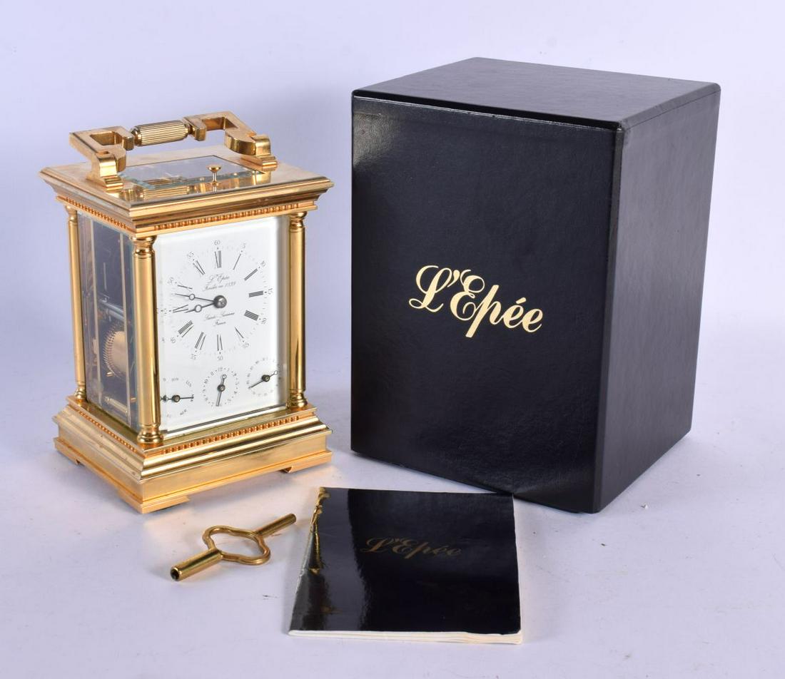 A BOXED L'EPEE TRIPLE DIAL CARRIAGE CLOCK. 21 cm high inc handle. (1 of 6)