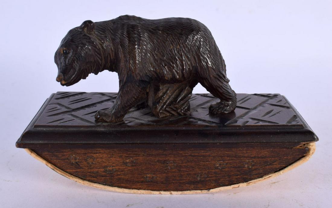 A 19TH CENTURY BAVARIAN CARVED BLACK FOREST DESK BLOTTER formed as a roaming bear. 13 cm x 8 cm. (1 of 4)