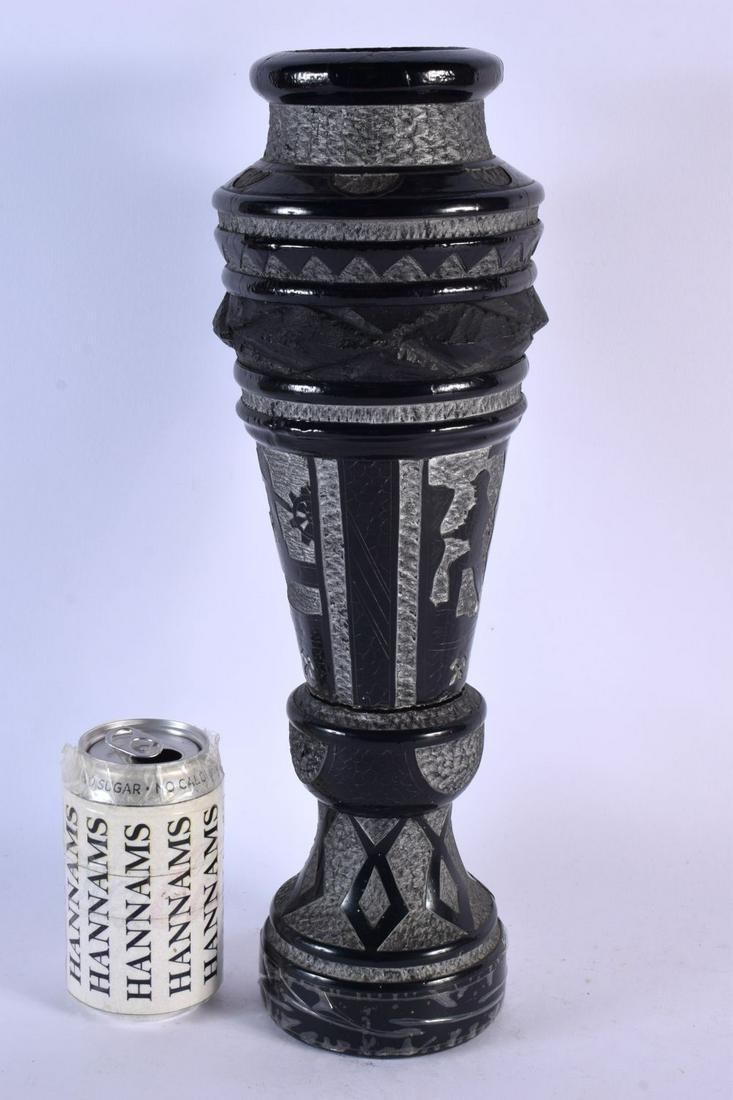AN UNUSUAL LARGE EUROPEAN CARVED COAL POLISH KATOWICE VASE depicting mining scenes. 38 cm x 8 cm.: AN UNUSUAL LARGE EUROPEAN CARVED COAL POLISH KATOWICE VASE depicting mining scenes. 38 cm x 8 cm.