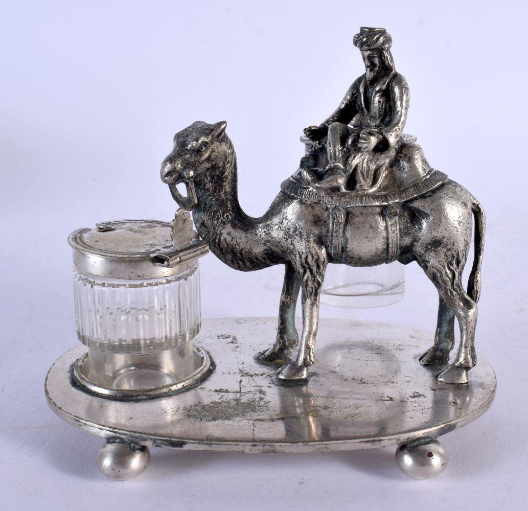 AN UNUSUAL EARLY 20TH CENTURY SILVER PLATED DESK STAND formed as a male upon a camel. 801 grams not (1 of 5)