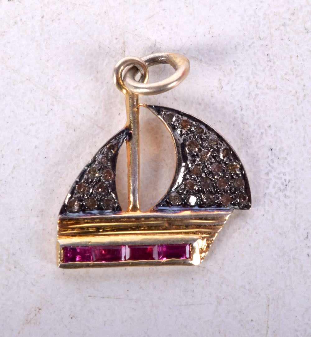 A NOVELTY GEM SET CHARM IN THE FORM OF AN ARAB DHOW.  2.1cm x 1.6cm, weight 1.3g (1 of 2)