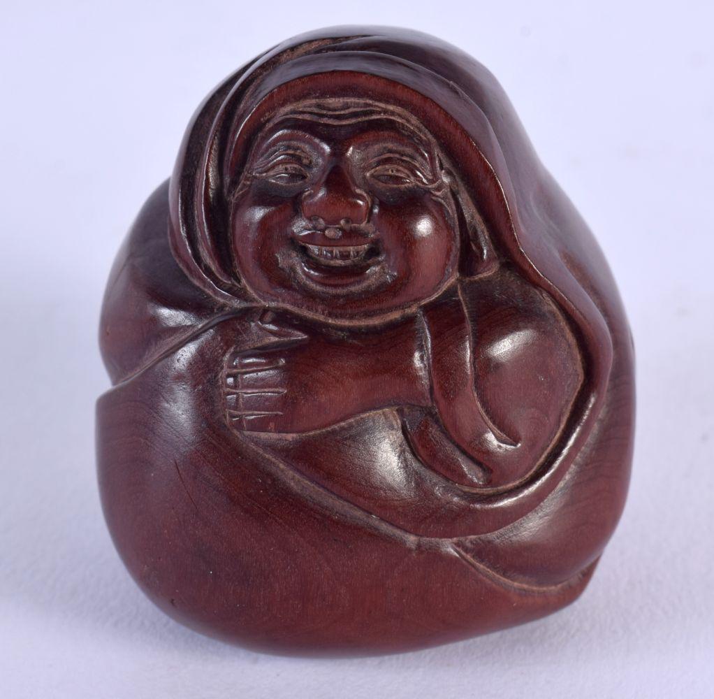 A JAPANESE CARVED WOOD MONK NETSUKE. 5.25 cm x 4.75 cm. (1 of 3)