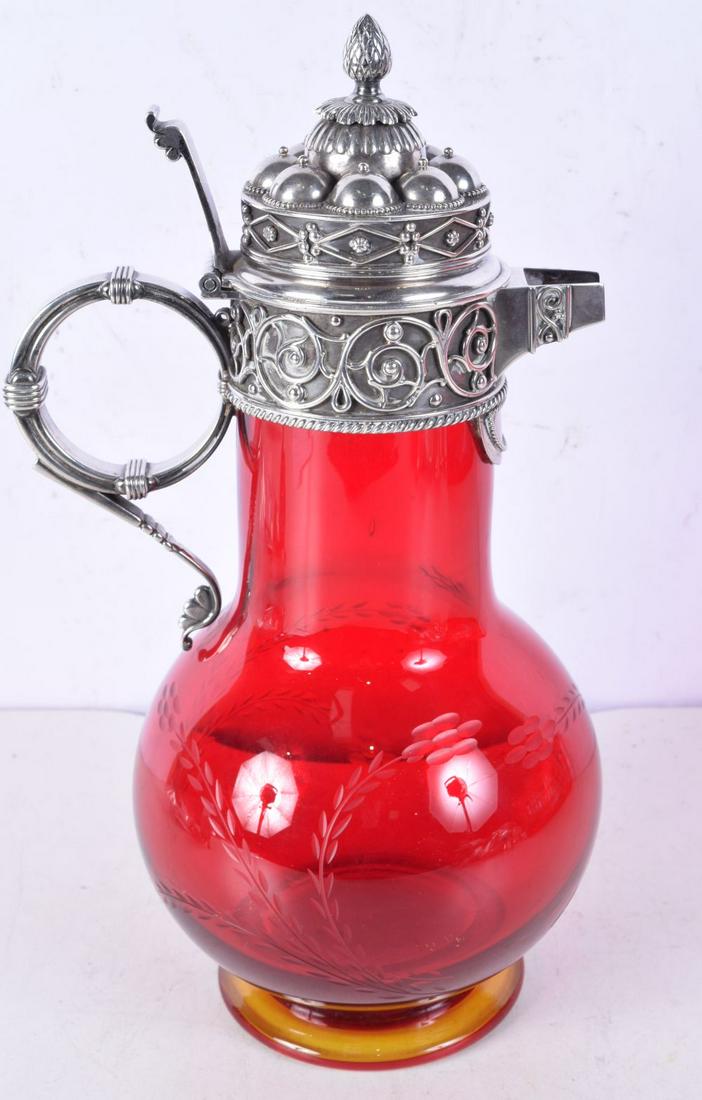 A VICTORIAN ETCHED RED GLASS CLARET JUG WITH SILVER MOUNTS BY THOMAS JOHNSON. Hallmarked London 187: A VICTORIAN ETCHED RED GLASS CLARET JUG WITH SILVER MOUNTS BY THOMAS JOHNSON. Hallmarked London 1877, 30cm x 15cm diameter, total weight 1668g