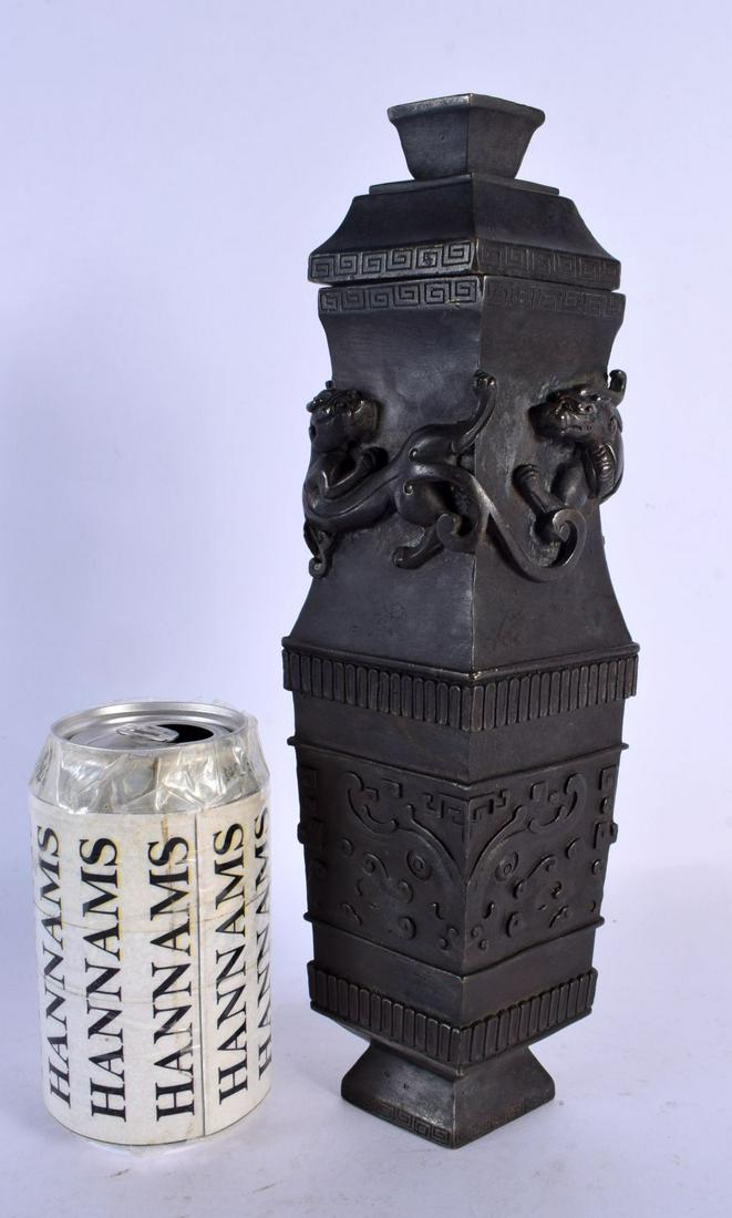 A FINE 18TH/19TH CENTURY CHINESE BRONZE LOZENGE SHAPED VASE AND COVER overlaid with chilong dragons, (1 of 6)