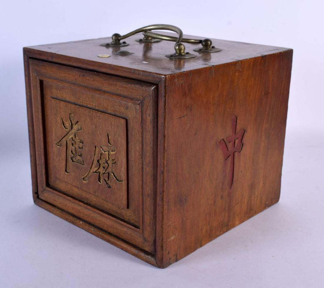 A LATE 19TH CENTURY CHINESE CARVED HARDWOOD MAHJONG SET with bone and bamboo counters. 18 cm x 18 cm: A LATE 19TH CENTURY CHINESE CARVED HARDWOOD MAHJONG SET with bone and bamboo counters. 18 cm x 18 cm.