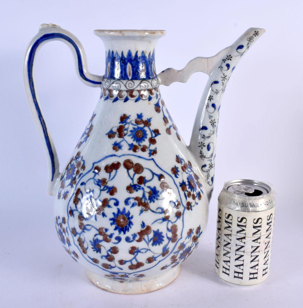 A LARGE TURKISH BLUE AND WHITE IRON RED PAINTED EWER painted with flowers. 30 cm x 22 cm. (1 of 4)