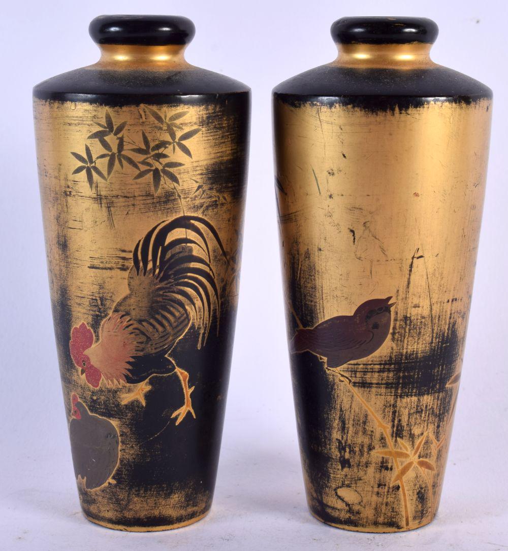 A PAIR OF EARLY 20TH CENTURY JAPANESE MEIJI PERIOD GOLD AND BLACK LACQUER VASES painted with fowl. 1 (1 of 4)
