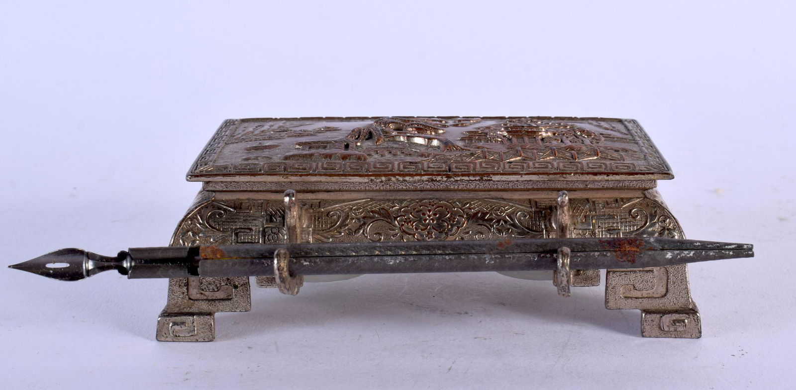 A 19TH CENTURY JAPANESE MEIJI PERIOD MIXED METAL INKWELL decorated in relief with landscapes. 12 cm (1 of 4)
