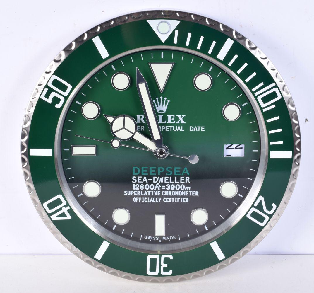 A Contemporary Rolex dealership style wall clock 34 cm: A Contemporary Rolex dealership style wall clock 34 cm