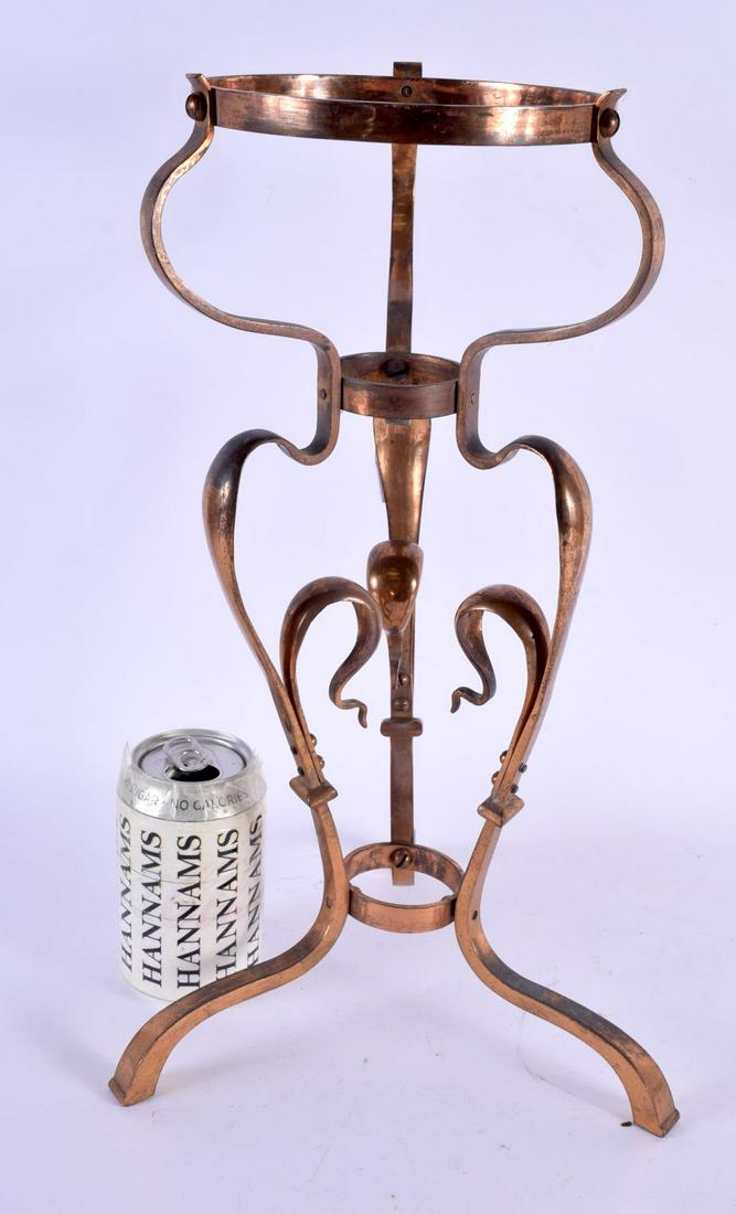 AN ART NOUVEAU COPPER STAND in the manner of Benson, of scrolling organic form. 40 cm x 18 cm.: AN ART NOUVEAU COPPER STAND in the manner of Benson, of scrolling organic form. 40 cm x 18 cm.