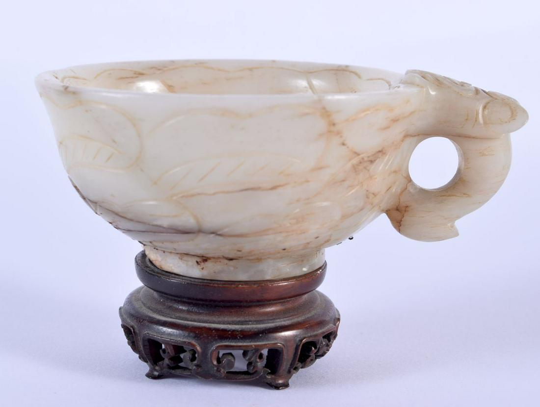 A 17TH/18TH CENTURY CHINESE MUTTON JADE LIBATION CUP Ming/Qing, modelled with a dragon mask head han (1 of 8)