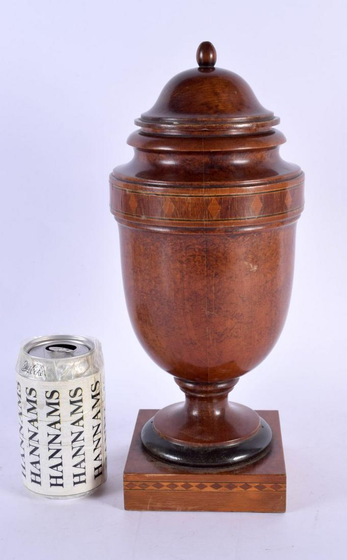 A LARGE EDWARDIAN TREEN CARVED AMBOYNA AND FRUITWOOD VASE AND COVER with diamond motif inlay. 35 cm: A LARGE EDWARDIAN TREEN CARVED AMBOYNA AND FRUITWOOD VASE AND COVER with diamond motif inlay. 35 cm x 11 cm.